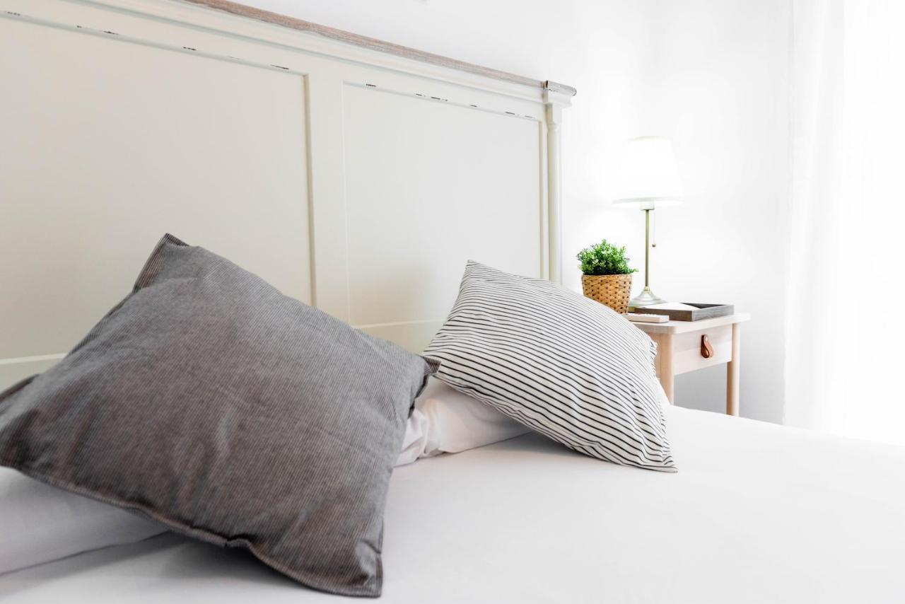 Apartamentos Toboso Plaza Nerja Exterior photo Pillows on a bed